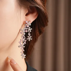 Elegant floral tassel drop earrings featuring pink and clear cubic zirconia on silver posts