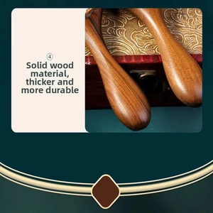 Detailed macro view of the polished sandalwood massage comb handle with natural wood grain