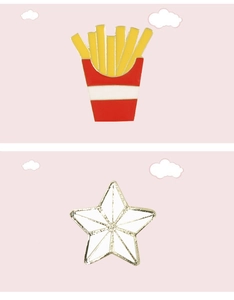 Detailed view of cute enamel pins featuring french fries and a white star for clothing
