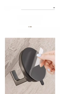Detailed view of the vacuum suction hook showing the removal of protective adhesive film