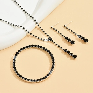 Elegant silver jewelry set with black zircon stones including necklace bracelet and earrings