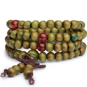 Detail of 108 sandalwood prayer beads in olive green with red accents and Chinese knots