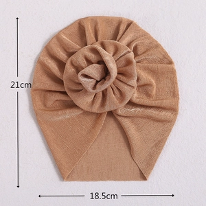 Camel baby turban hat with 3D flower knot and dimensions 21cm by 18.5cm on neutral background