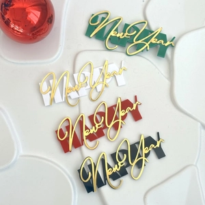 Acrylic Happy New Year cake toppers in green white red and black with gold lettering