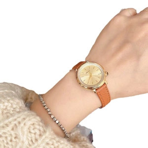 Elegant gold quartz watch with grey leather strap and mother of pearl dial for women