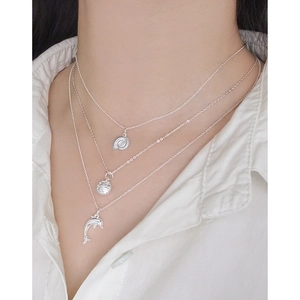 Three-layer S925 silver necklace featuring shell, textured ball, and dolphin charms for women