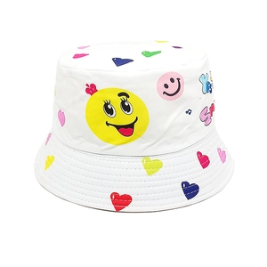 Detail of white kids bucket hat with colorful smile, heart, and musical note prints