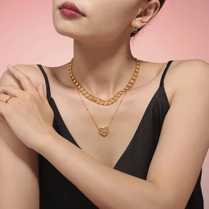 Double-layered gold heart pendant necklace for women with a vintage minimalist style