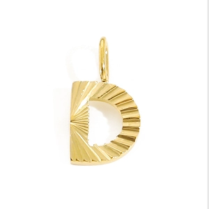 Detailed view of a gold letter D pendant featuring an elegant sunburst metal texture