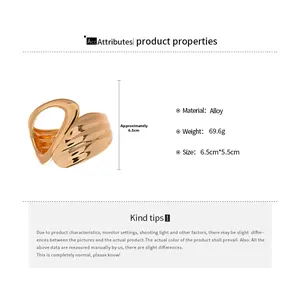 Detail view of gold abstract hollow geometric bangle with size 6.5cm and alloy texture