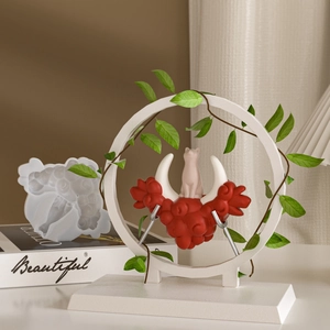 Detailed resin cat figurine on red cloud base inside a decorative moon ring frame