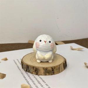 Macro detail of hand-carved wooden rabbit figurine with artisan texture and pink blush
