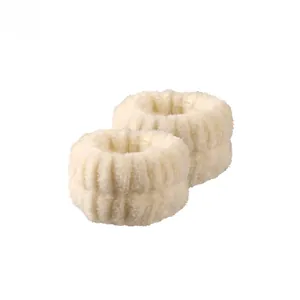 Close-up of soft white coral fleece wristbands for washing face with wavy texture