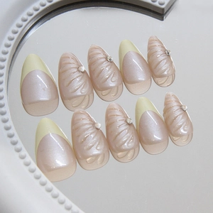 French press-on nails with yellow tips, 3D shell patterns and pearl glitter finish