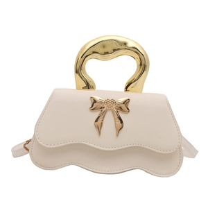 Elegant cream white crossbody bag with wavy base and golden bow metal handle