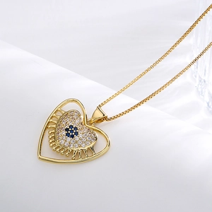 18K gold plated copper necklace with zircon heart pendant on white silk background