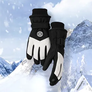 Detail of insulated ski gloves with touchscreen fingertips and windproof adjustable straps