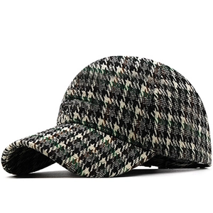 Close-up of thick houndstooth fabric texture on a vintage style baseball cap