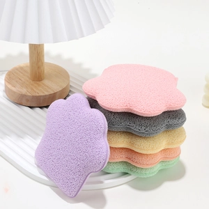 Set of 6 flower-shaped soft facial cleansing sponges in various pastel colors on white
