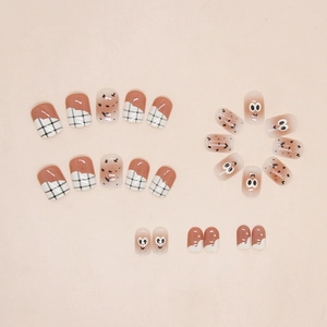 Detail of 24pcs cute eye press-on nails with warm coffee plaid and dot patterns