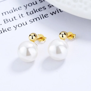 Macro shot of S925 sterling silver hallmark on golden freshwater pearl heart earrings