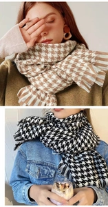 Detail showing soft mohair scarf with houndstooth pattern and delicate tassels
