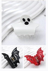 Detail of Halloween ghost and bat hair clips featuring durable acrylic and metal springs