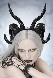 Macro detail of glossy black ram horns headband for gothic Halloween cosplay costumes