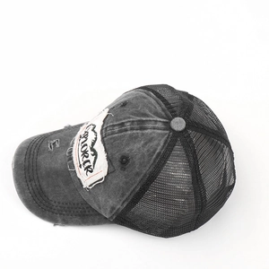 Detail of vintage washed grey trucker hat featuring Explorer embroidery and breathable mesh