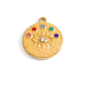 Detailed view of evil eye pendant with colorful zircons and golden hammered texture