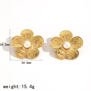 Golden flower earrings set with white pearls and textured petals shown with dimensions