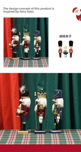 Detailed view of 25cm wooden nutcracker soldiers set with pearlescent pink accents