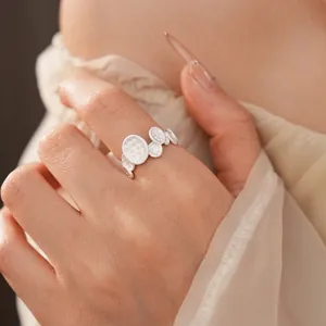 Elegant silver open ring with textured hammered oval discs for women minimalist style