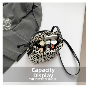 Interior view showing the large storage capacity of the leopard print bucket bag