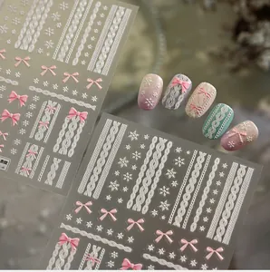 Detailed 5D embossed nail stickers featuring sweater textures, bows and winter snowflakes