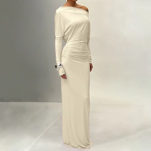 Detail of off-white long sleeve maxi dress featuring elegant side ruched fabric texture