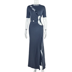 Detail of black cut-out dress with asymmetrical waist openings and high side slit