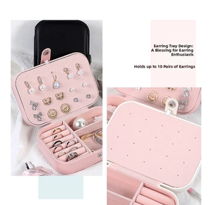 Detail of pink leather jewelry box showing earring plate for 10 pairs and ring slots