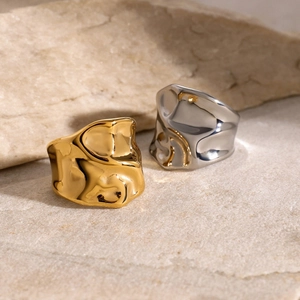 Close-up of gold and silver hammered lava texture 18k gold plated stainless steel rings