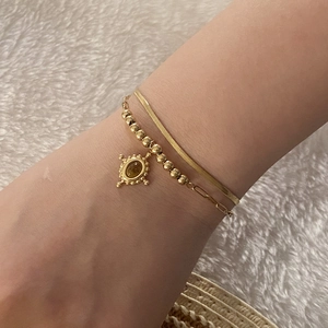 Double-layered gold tiger eye stone bracelet with sleek snake chain for women