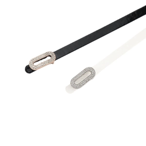 Polished black and white patent leather skinny belts with sparkling rhinestone buckles