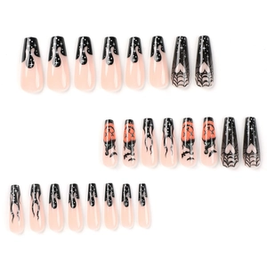 Halloween coffin press-on nails with black French flames, pumpkin, and spider web designs