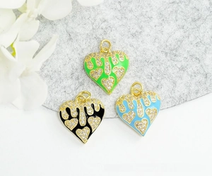 Detailed view of colorful heart charms with 18K gold plating and white rhinestones