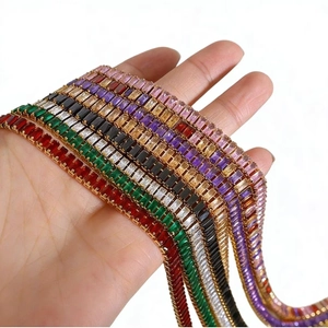 Luxe multicolor zircon tennis bracelet set in gold plating held by hand