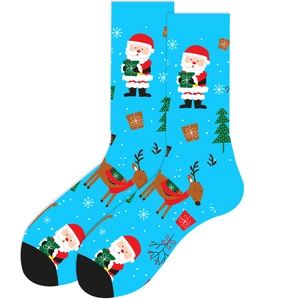 Detailed pattern of Santa, reindeer, and Christmas trees on light blue cotton socks