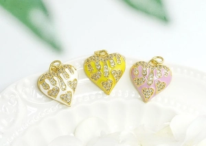 Detail of 18K gold plated heart charms with colorful enamel and pavé cubic zirconia