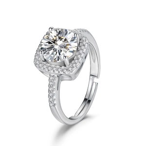 Macro shot of silver adjustable halo ring with round main stone and pave diamonds