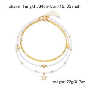 Détail du collier de perles multicouches avec étoile de mer, coquillage et dimensions