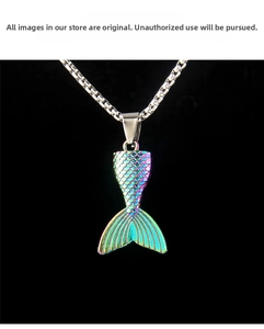 Detailed macro of a colorful iridescent fishtail pendant necklace with gradient scales
