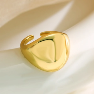 Polished 18K gold-plated chunky ring with irregular geometric shield design and open band